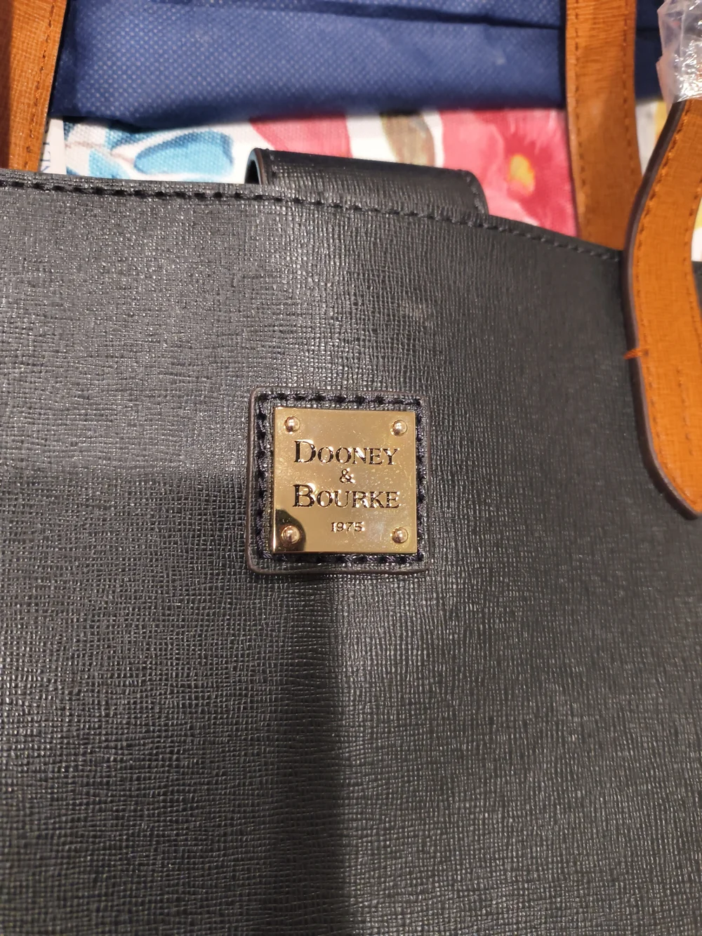 Dooney & Bourke Black Tote with Tan Handles and Gold Logo Plaque